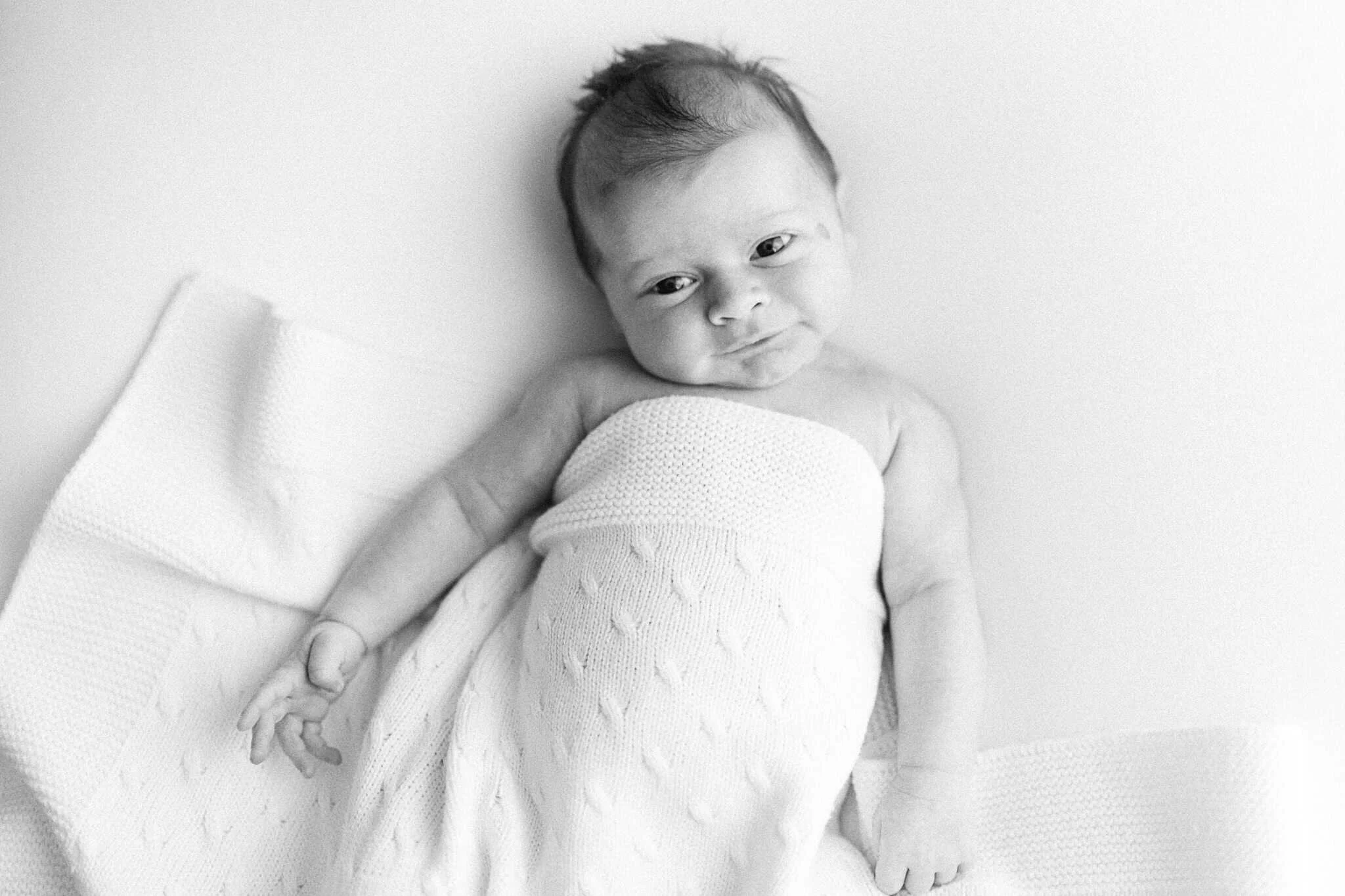 Awake 10 day old baby during natural newborn photoshoot in Cornwall