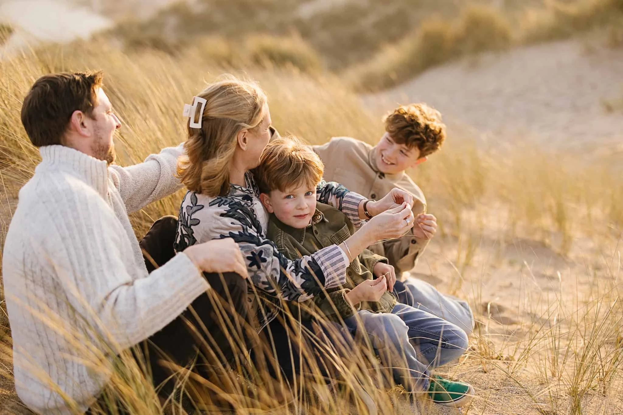 relaxed family photography session on sand dunes in Cornwall with young children