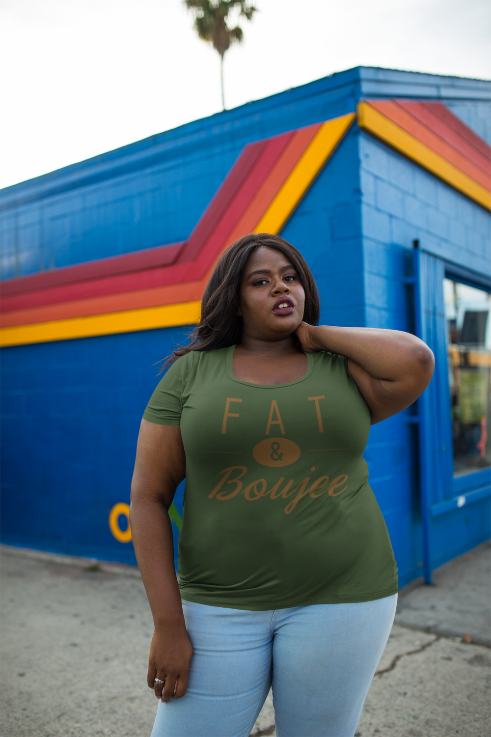 plus-size-round-neck-t-shirt-mockup-featuring-a-woman-outside-a-blue-and-orange-store-18295+%281%29.png