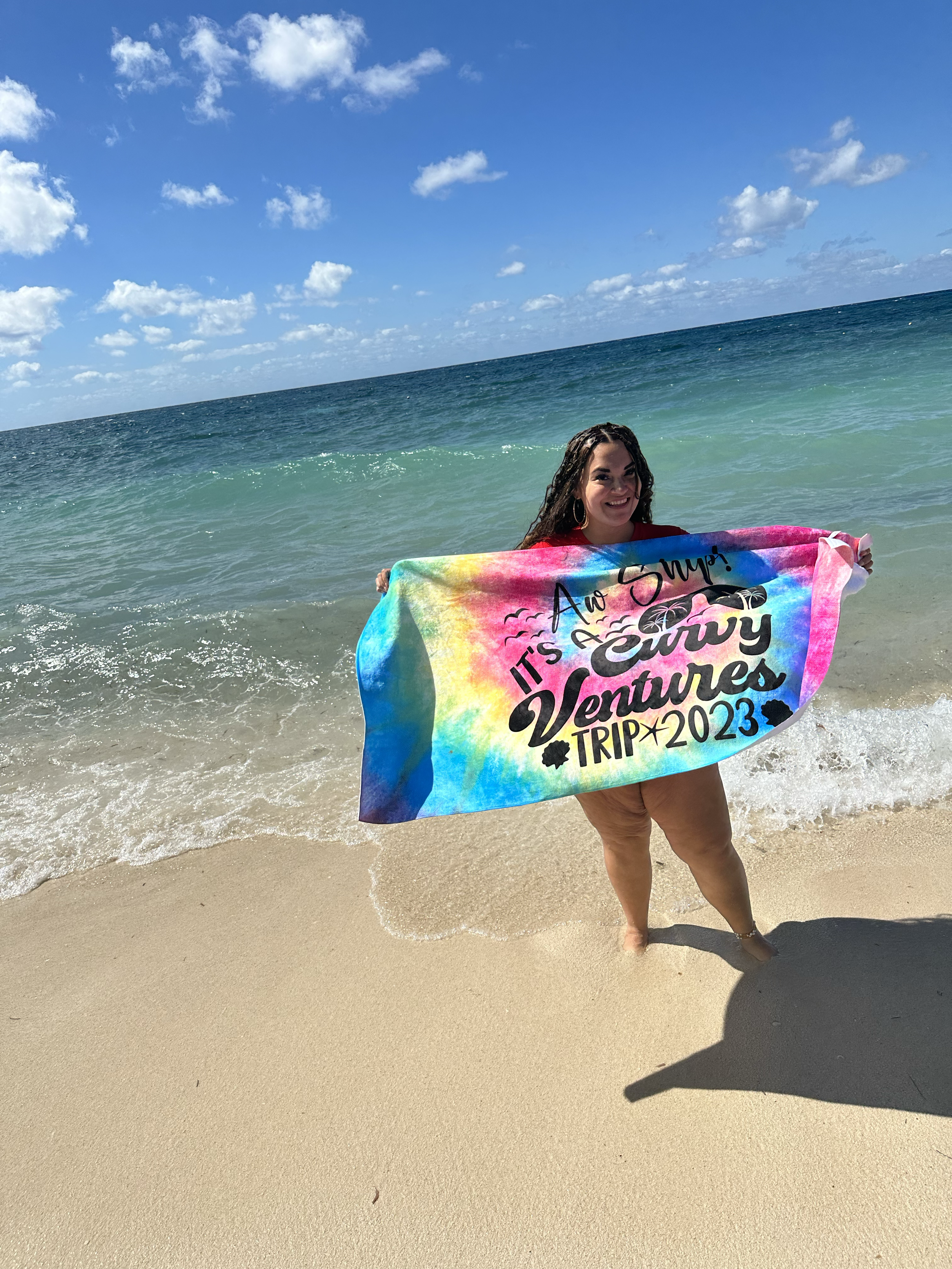 Woman holding a Curvy Ventures towel.