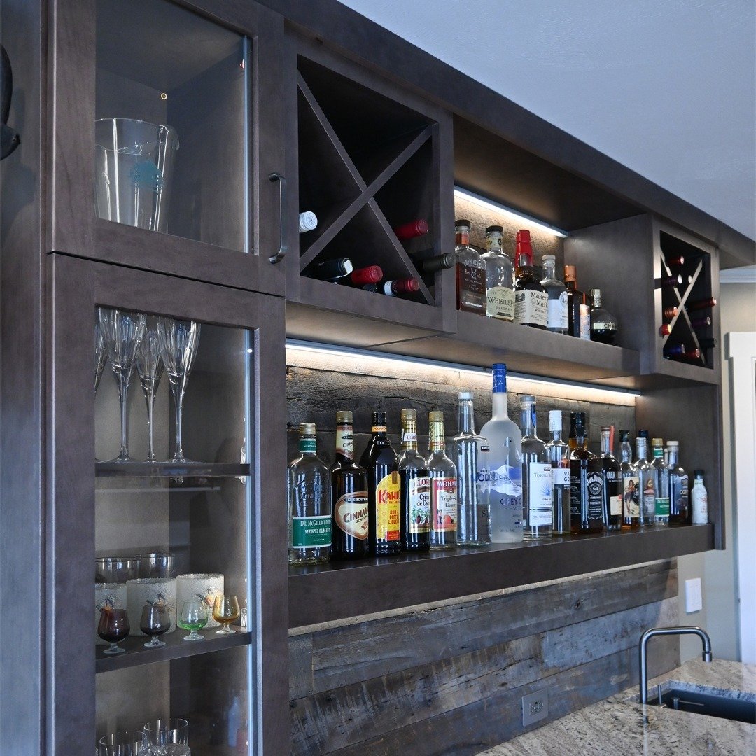 We have to give credit to the homeowners for one of the beautiful aspects of this bar. To fit with the rustic theme of this room, they added their own backsplash using the wood from their last home. This was a fantastic way to connect their old home 