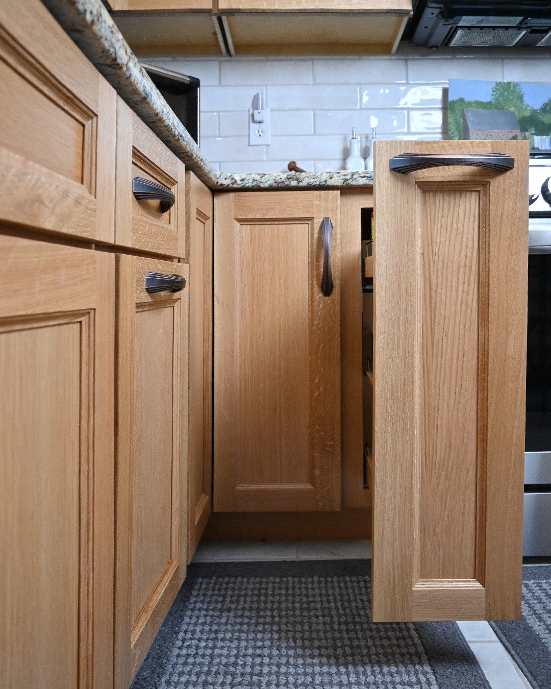 This pullout spice drawer is in one of the most functional and popular locations&mdash;easily within reach while cooking.