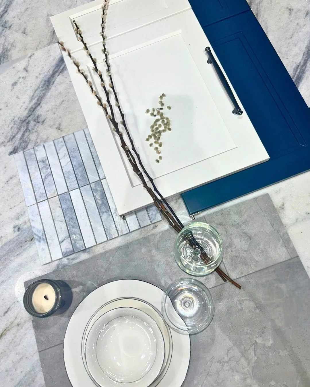 &quot;Willow&quot;

This mood board captures a fresh and modern kitchen aesthetic with a balance of crisp contrast and calming textures. Clean white shaker cabinetry is paired with a bold navy door, accented by a sleek matte black handle for a touch 