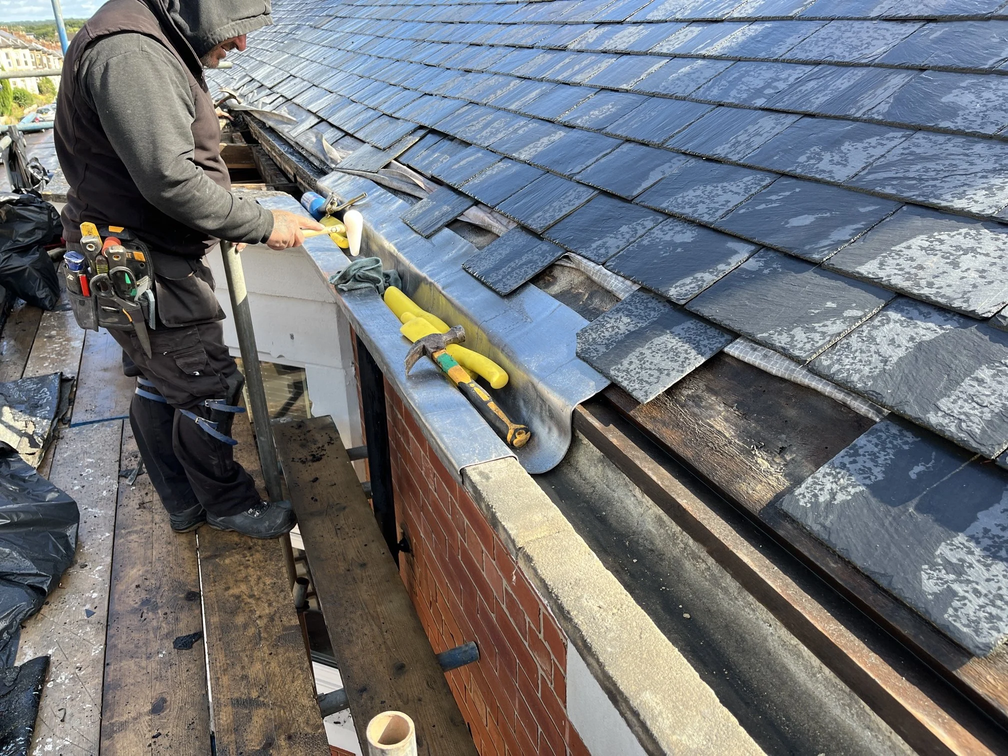Bay window flat roof replacement on upper-floor Tyneside flat, South Gosforth — EPDM rubber with lead-lined stone cornice gutter