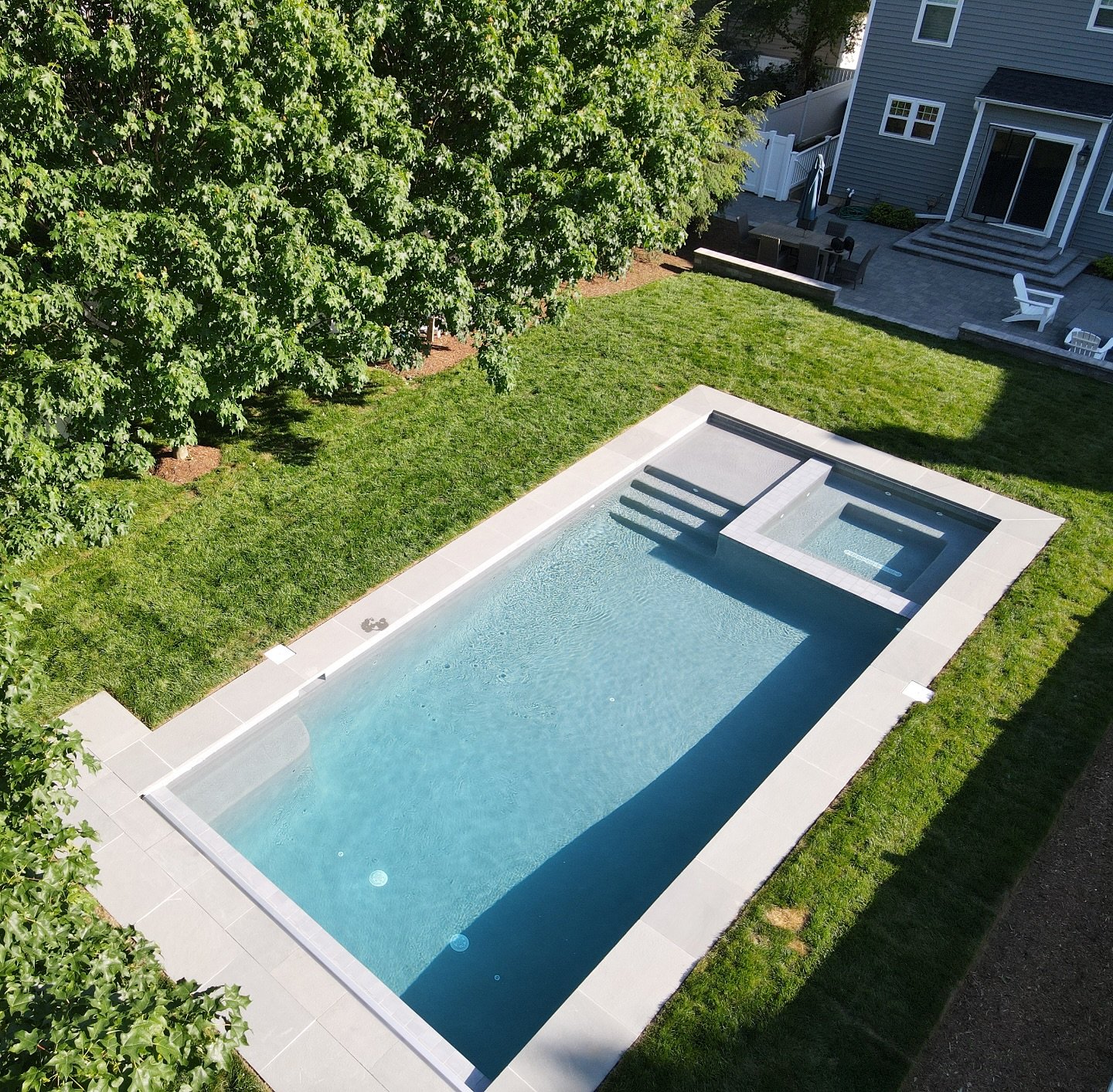 Nantucket charm with a Naptown twist ⛵️

This pool skips the typical patio for a softer, classic look&mdash;grass, bluestone, and East Coast elegance.

#NantucketStyle
#NaptownLiving
#CoastalBackyard
#BluestoneCoping
#AnnapolisPools
#BackyardInspo
#O