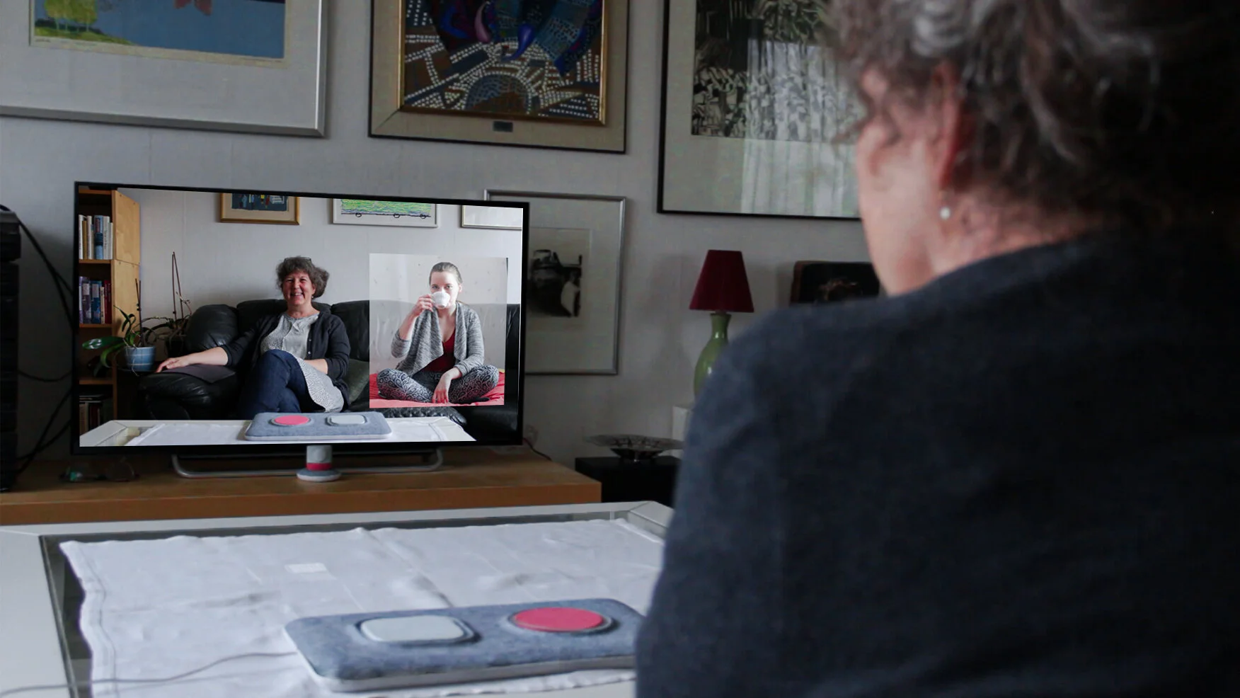While grandma is watching the content on the TV screen, Hannah receives the notification that grandma accessed the content and she can drop in, if she wants to.