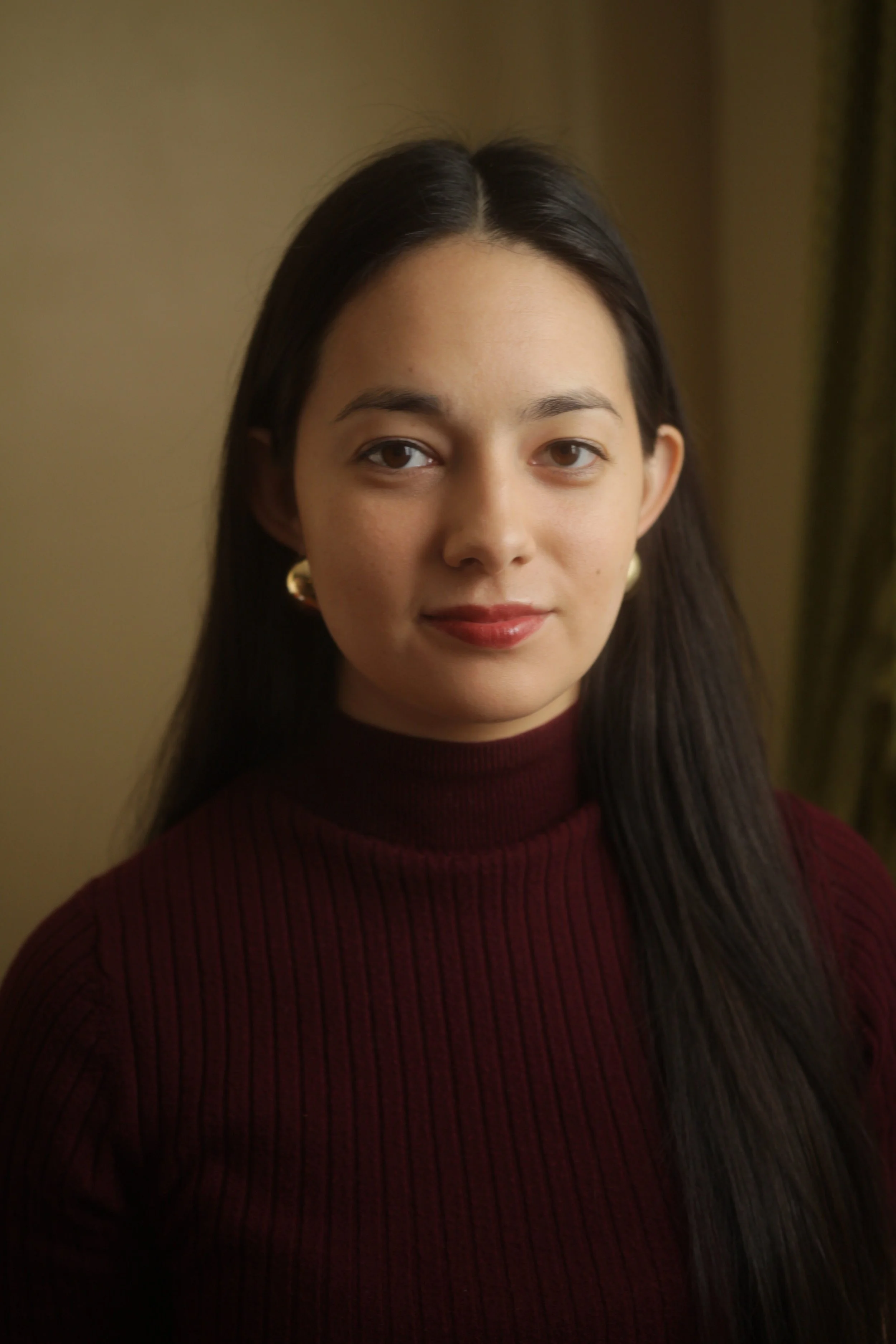 A headshot of Rachel