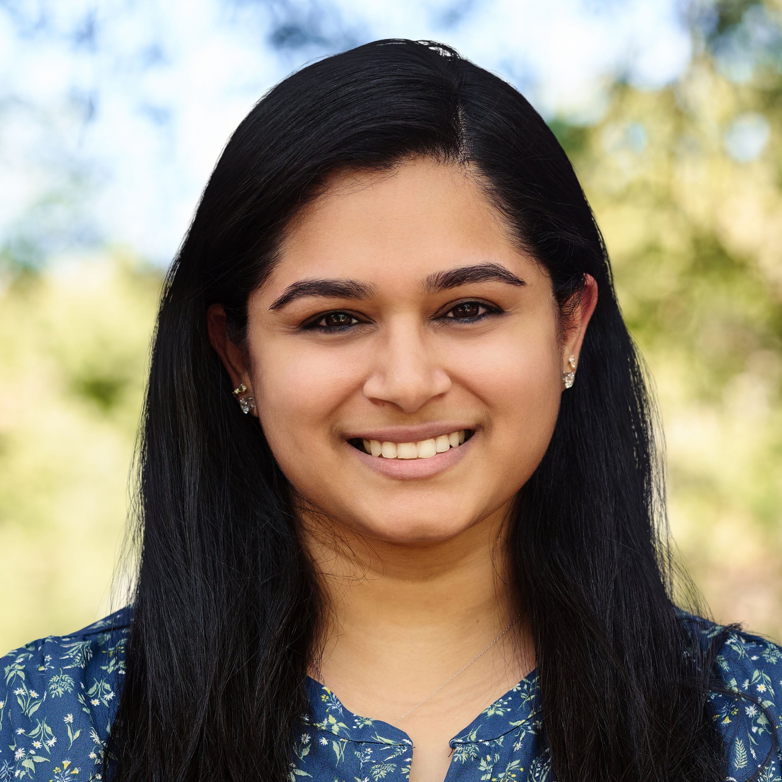 A circular logo with a gold background and white stylized text that reads 'WI3'