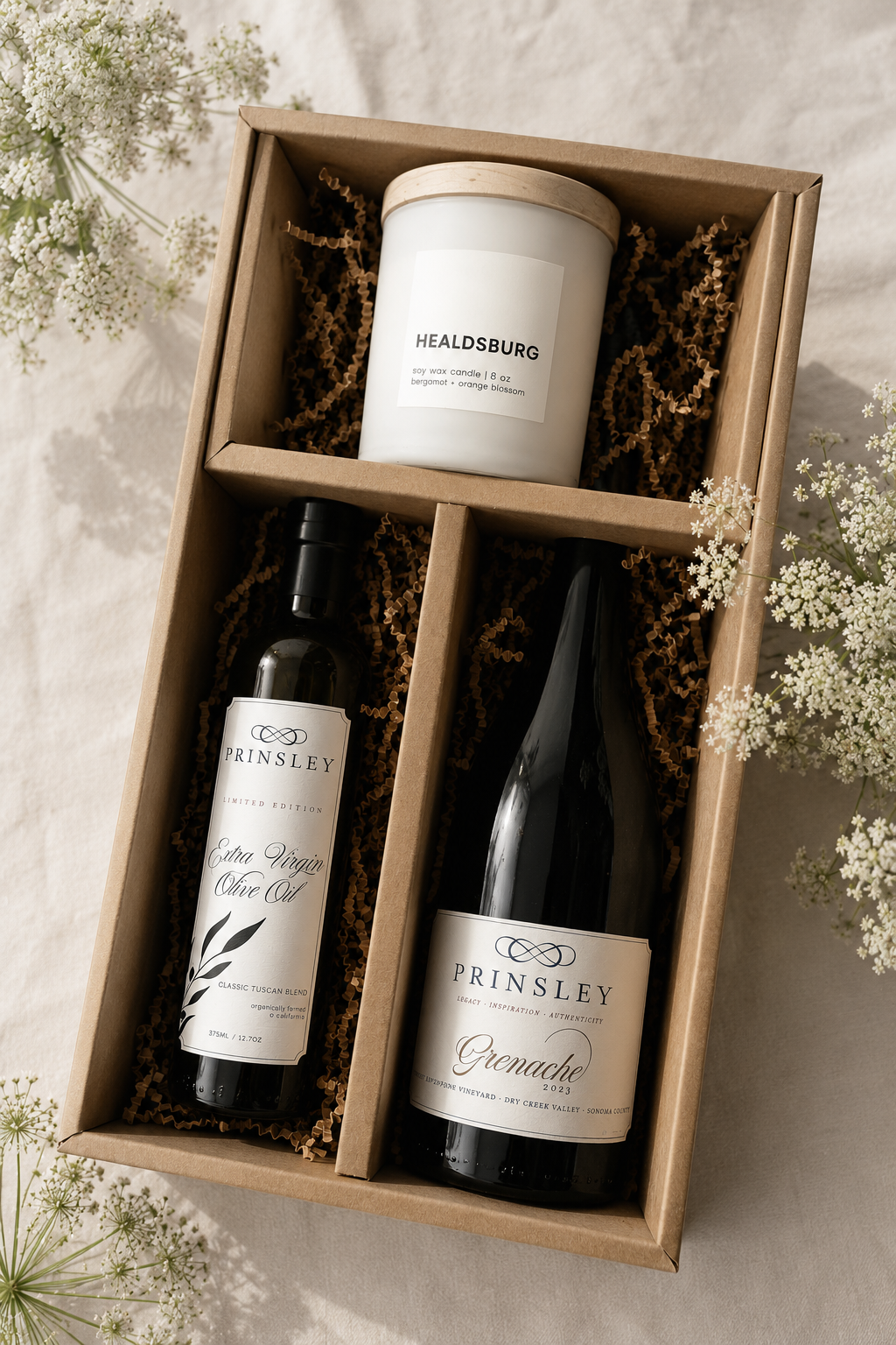 Bottle of Prinsley Red wine, olive oil and Intently Good Candle in a gift box. gift is called the date night.
