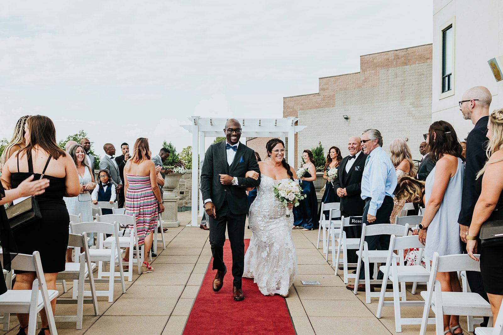 Bride and groom walk down the aisle and celebrate photo by Fedora Media.jpg