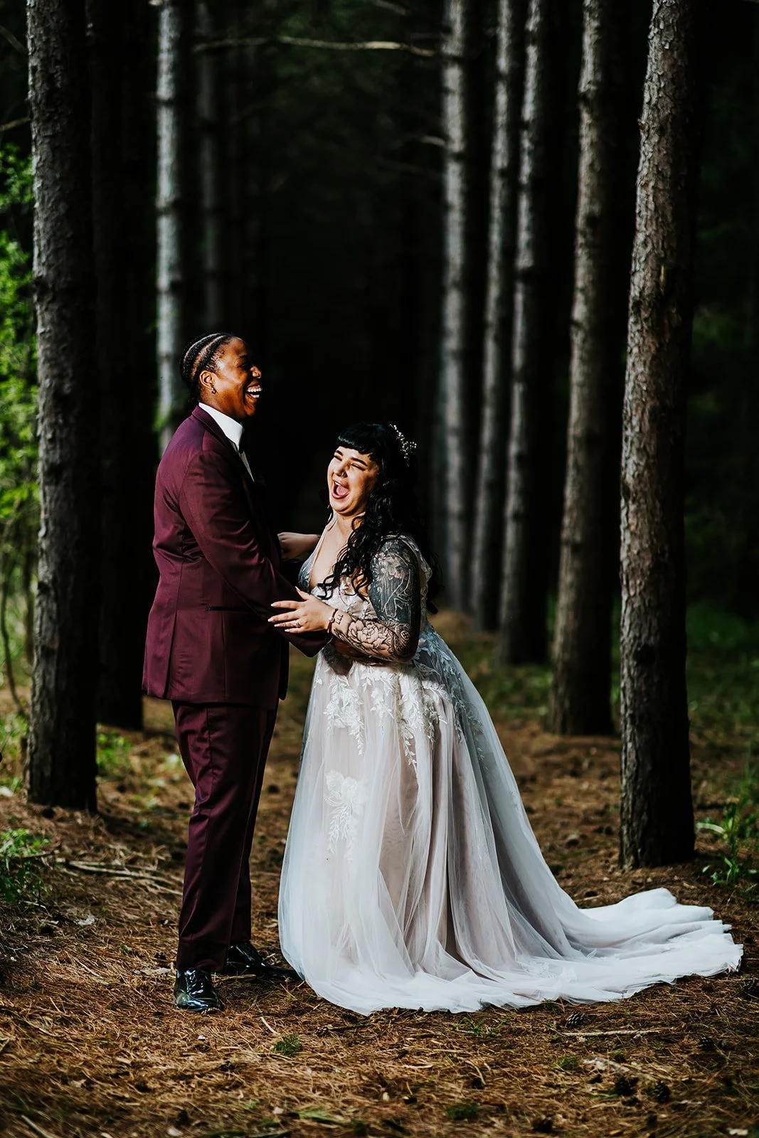 Bride and bride have candid moment in the woods at Erin Estate photo by Fedora Media.jpg