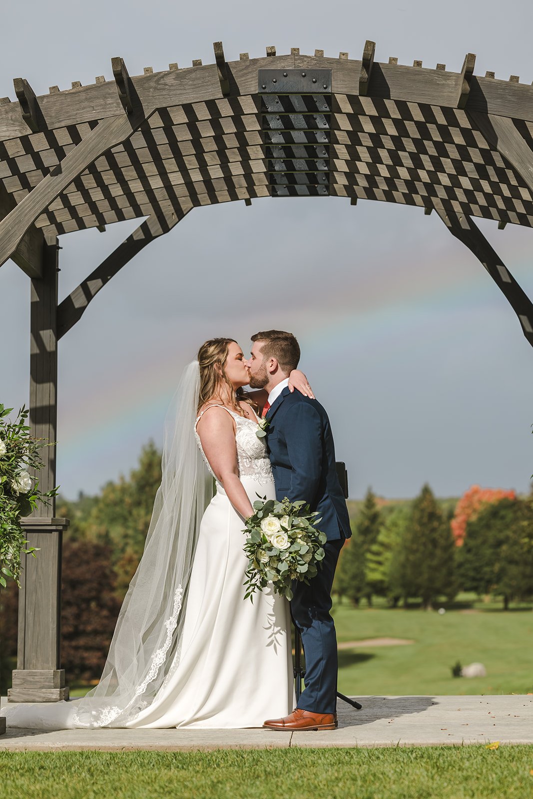 Wedding under a rainbow photo by Fedora Media