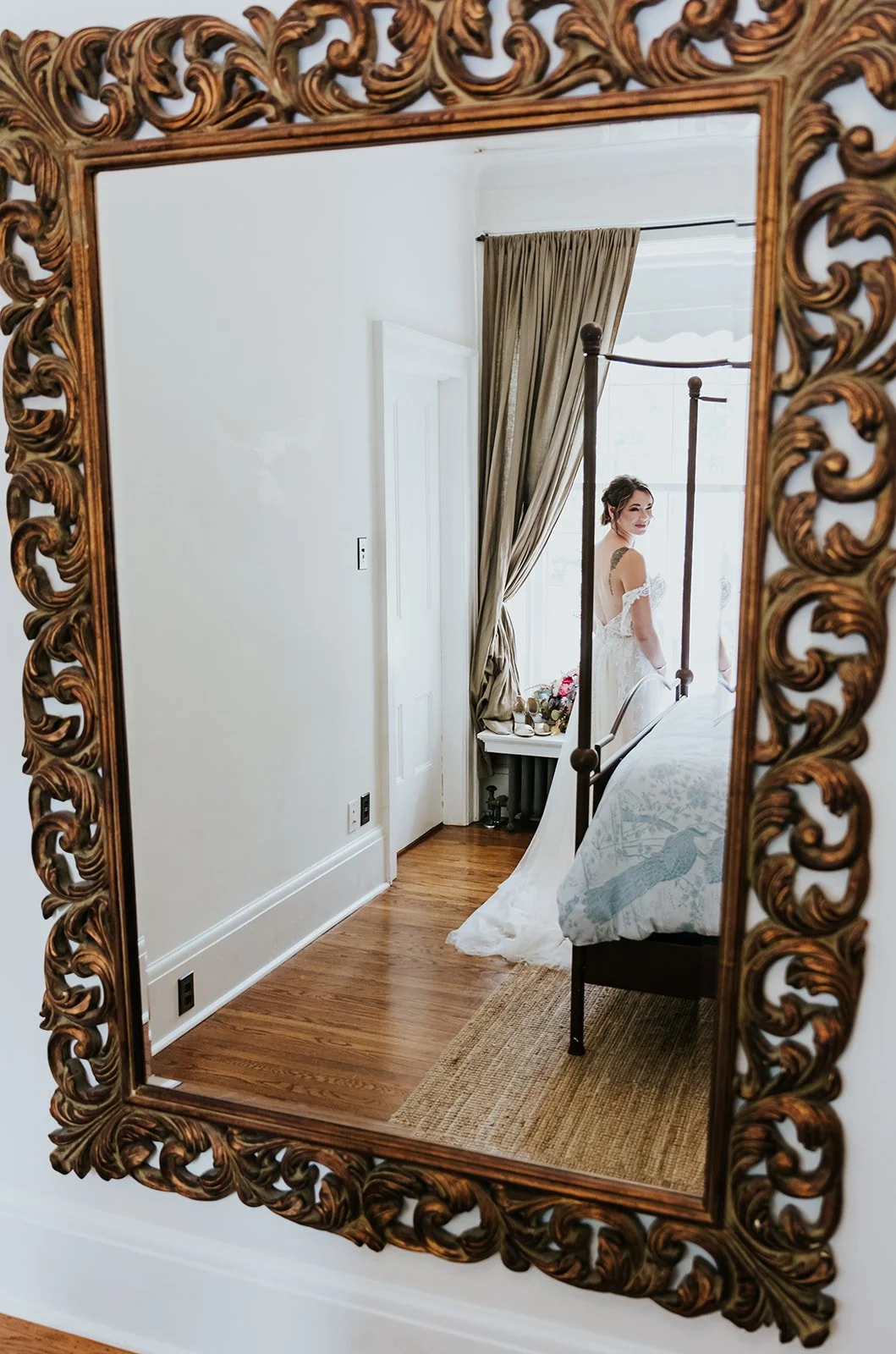 Bride looking at her reflection photo by Fedora Media.jpg
