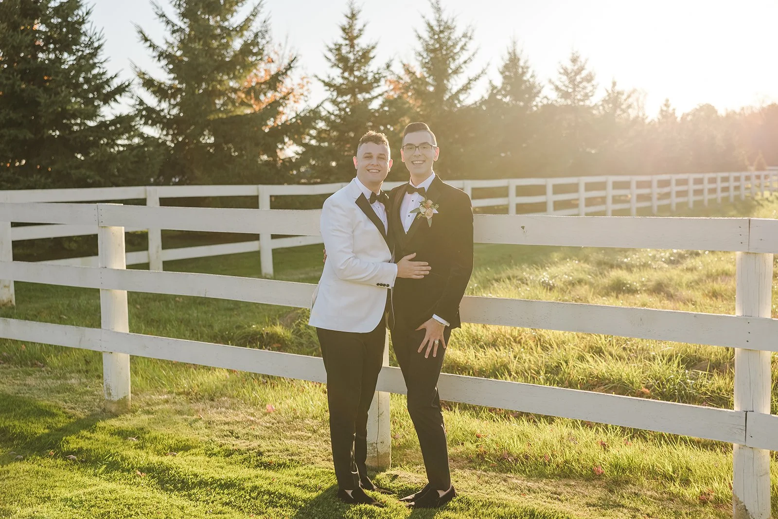 Grooms Smiling By Fence At Golden Hour Sunset Fedora Media Millgrove Ontario Earth To Table The Farm.jpg