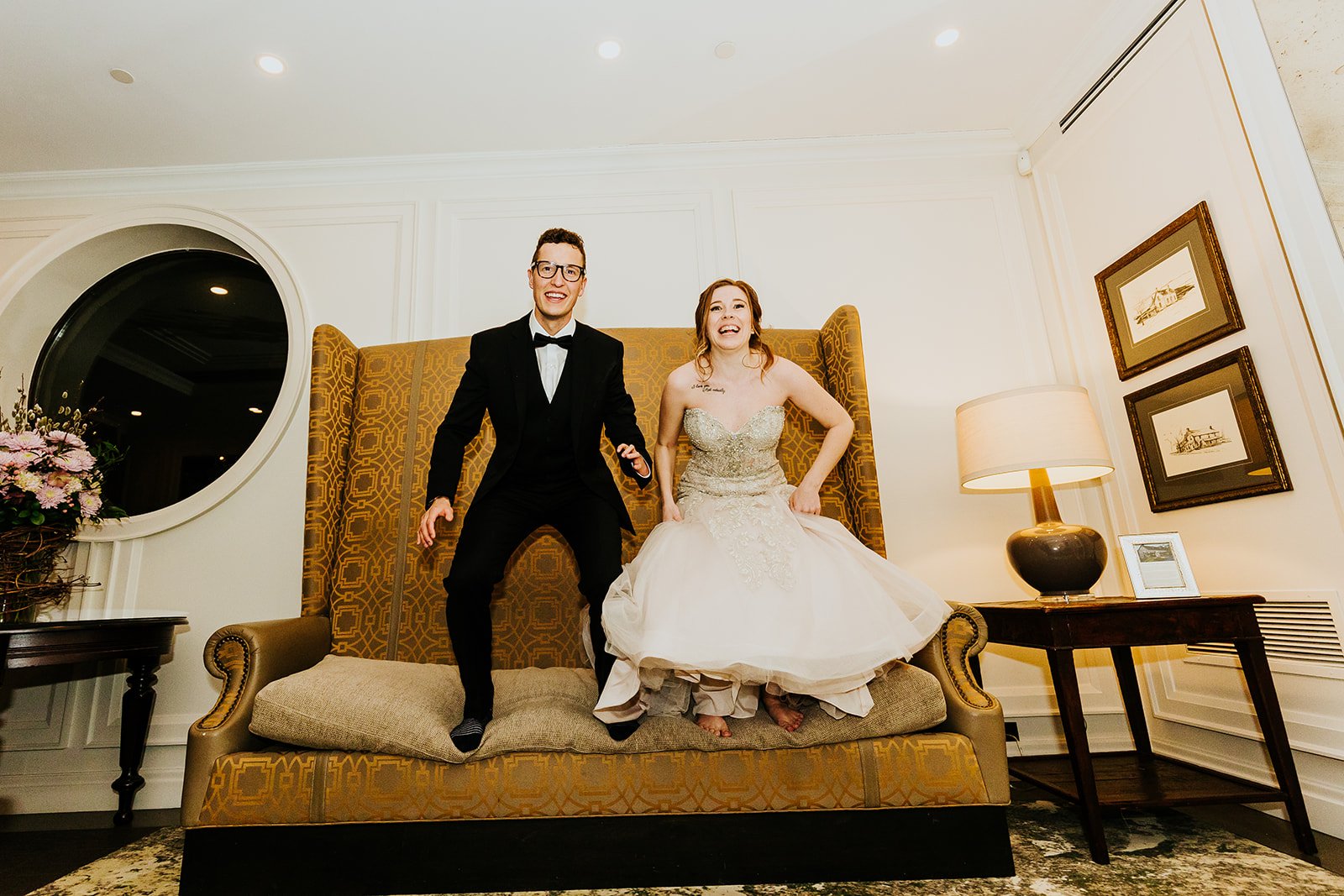Bride and groom jump for joy at the Ancaster Mill photo by Fedora Media.jpg