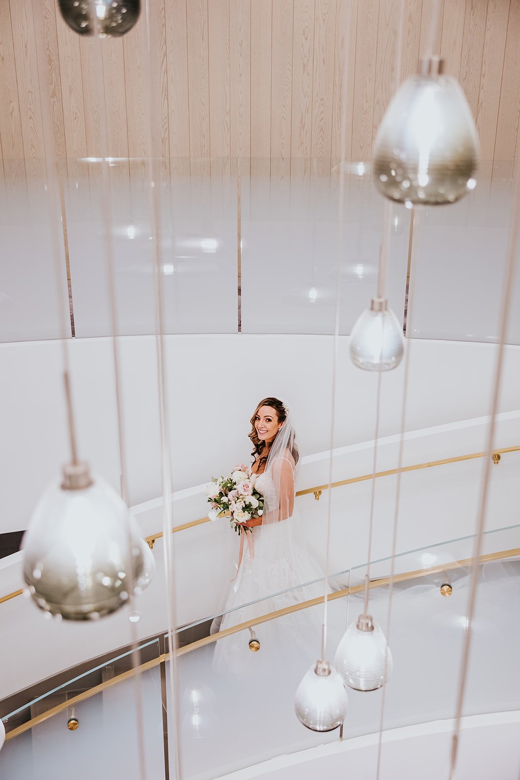 Bride in the staircase at Pearle Hotel and Spa photo by Fedora Media.jpg