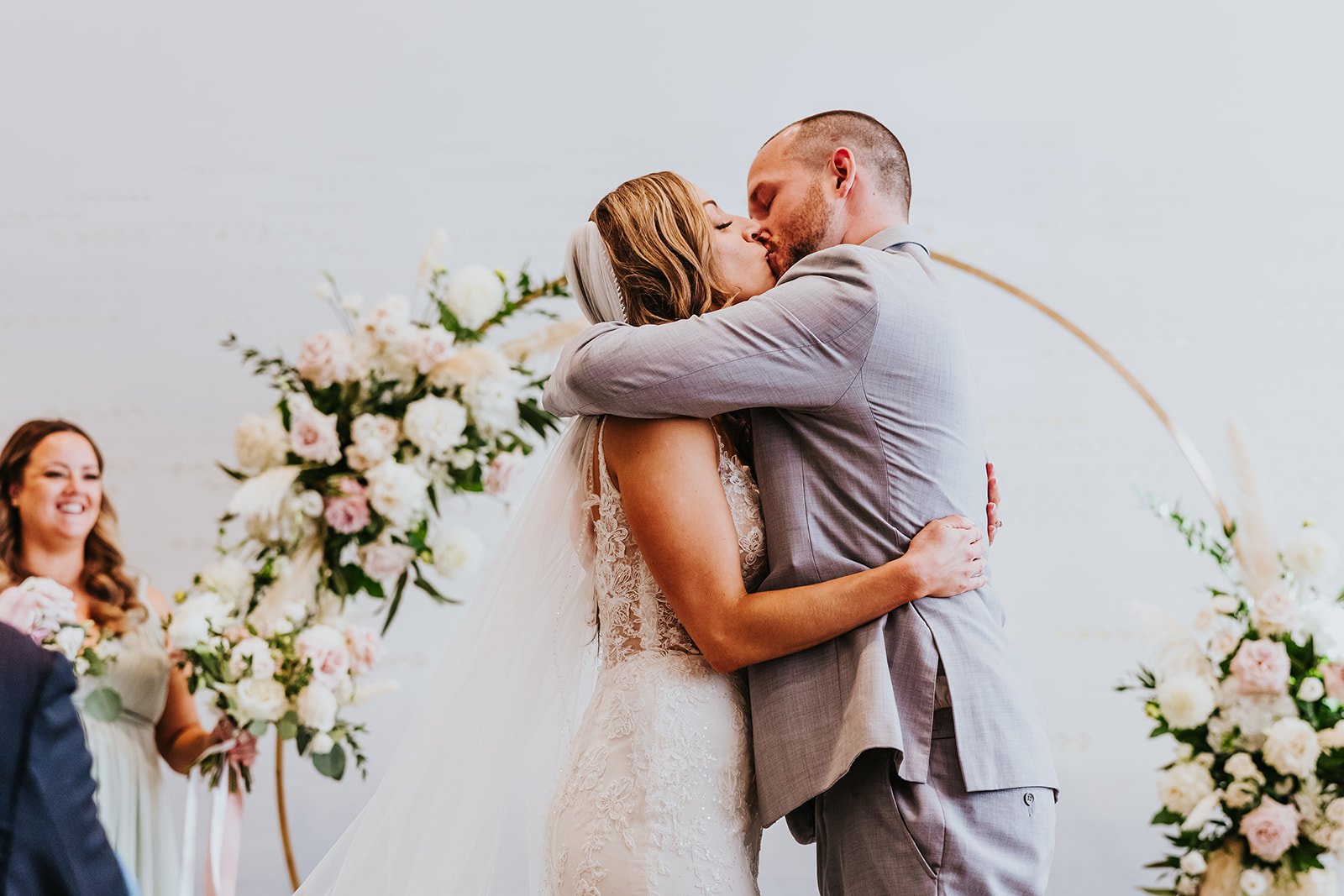 Bride and groom first kiss at Pearle Hotel and Spa photo by Fedora Media.jpg