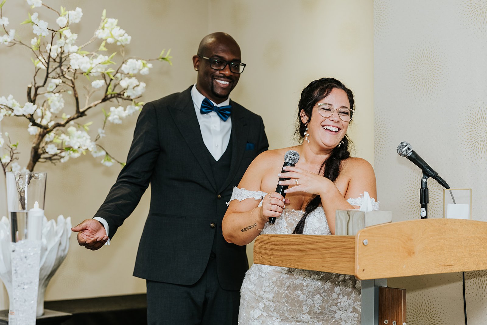 Candid bride and groom at reception speech at C Hotel photo by Fedora Media.jpg