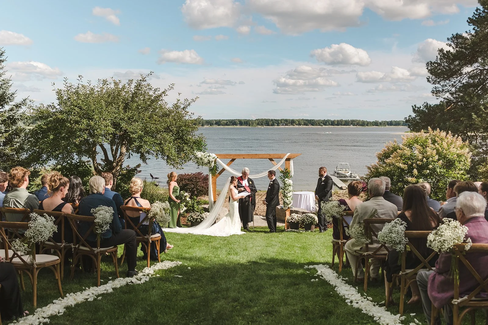 Backyard Wedding Ceremony Along Lake  Fedora Media.jpg