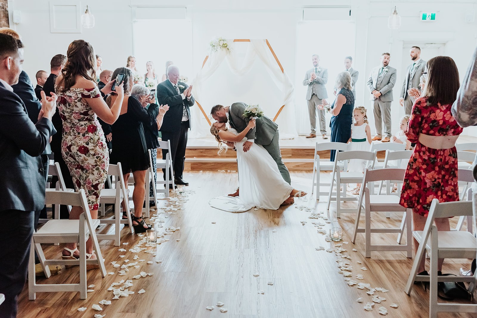 Groom dips his bride for a kiss at The Spice Factory photo by Fedora Media.jpg