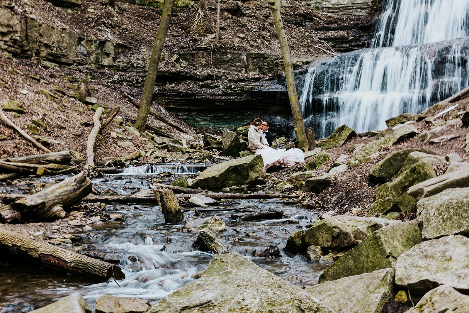 Wide angle shot of bride and groom at Sherman Falls photo by Fedora Meida.jpg