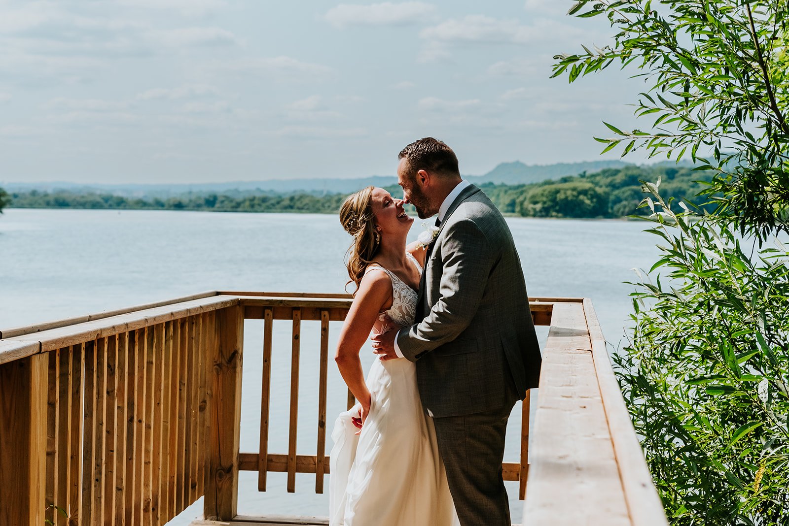 Candid bride and groom at the lake photo by Fedora Media.jpg