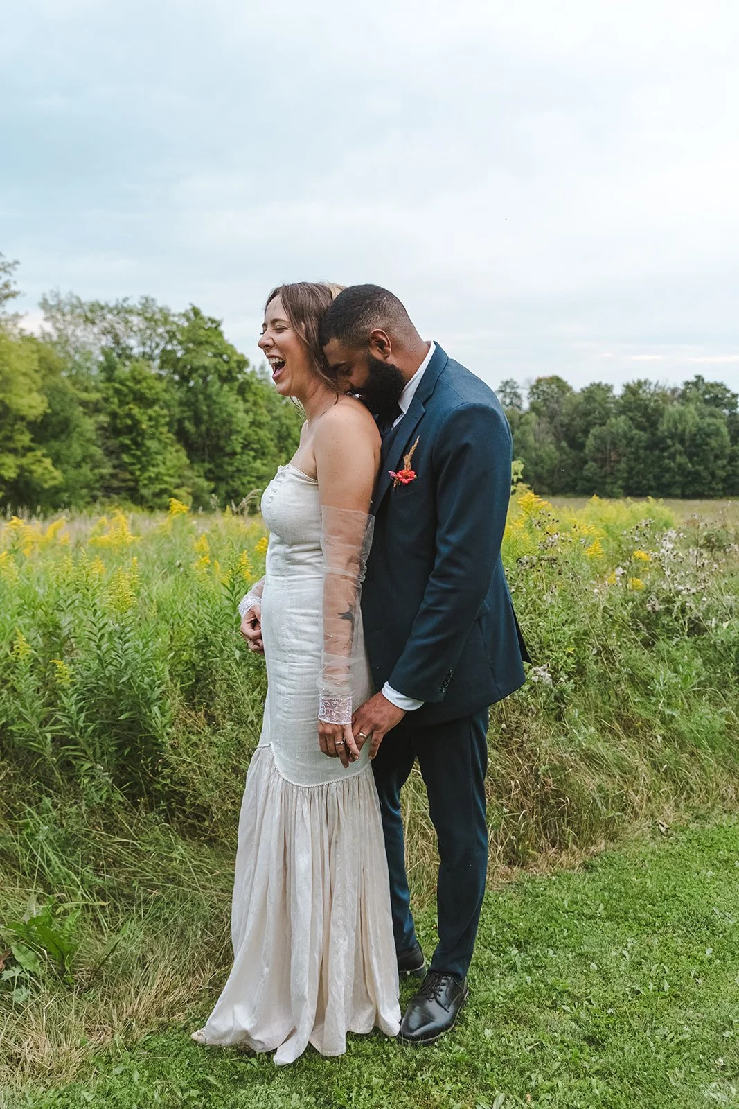 Groom Kisses Brides Shoulder  Fedora Media  Backyard Wedding.jpg