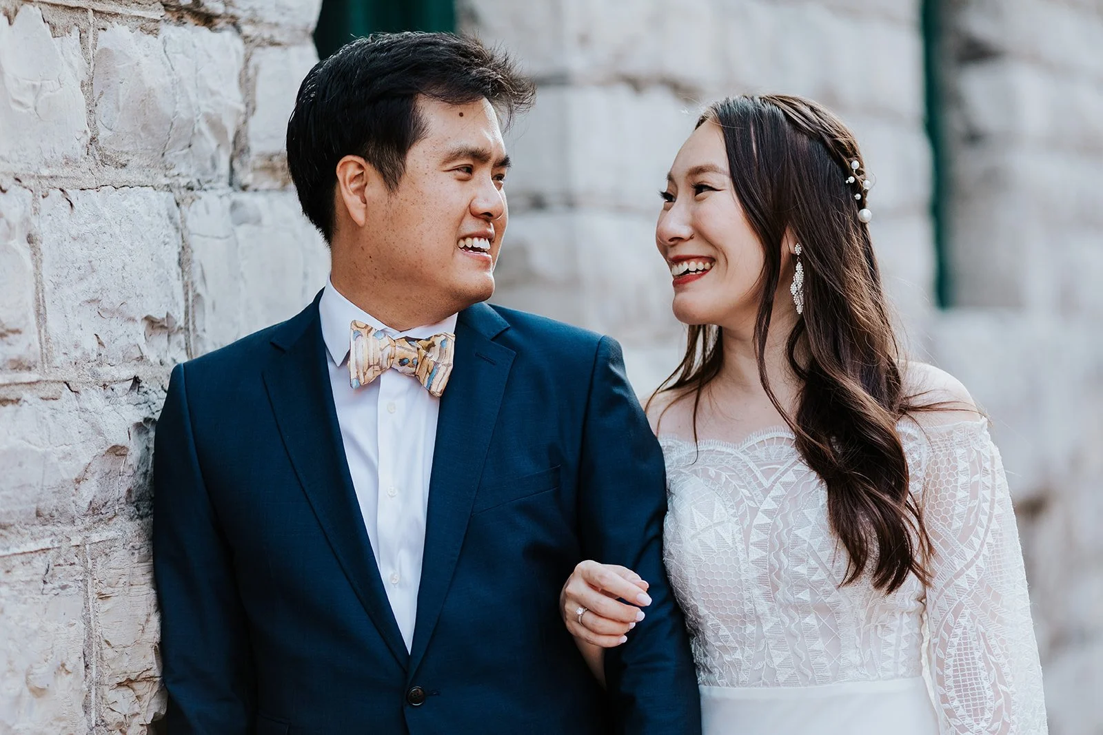 Bride and groom smile during Distillery District Toronto wedding photoshoot photo by Fedroa Media.jpg