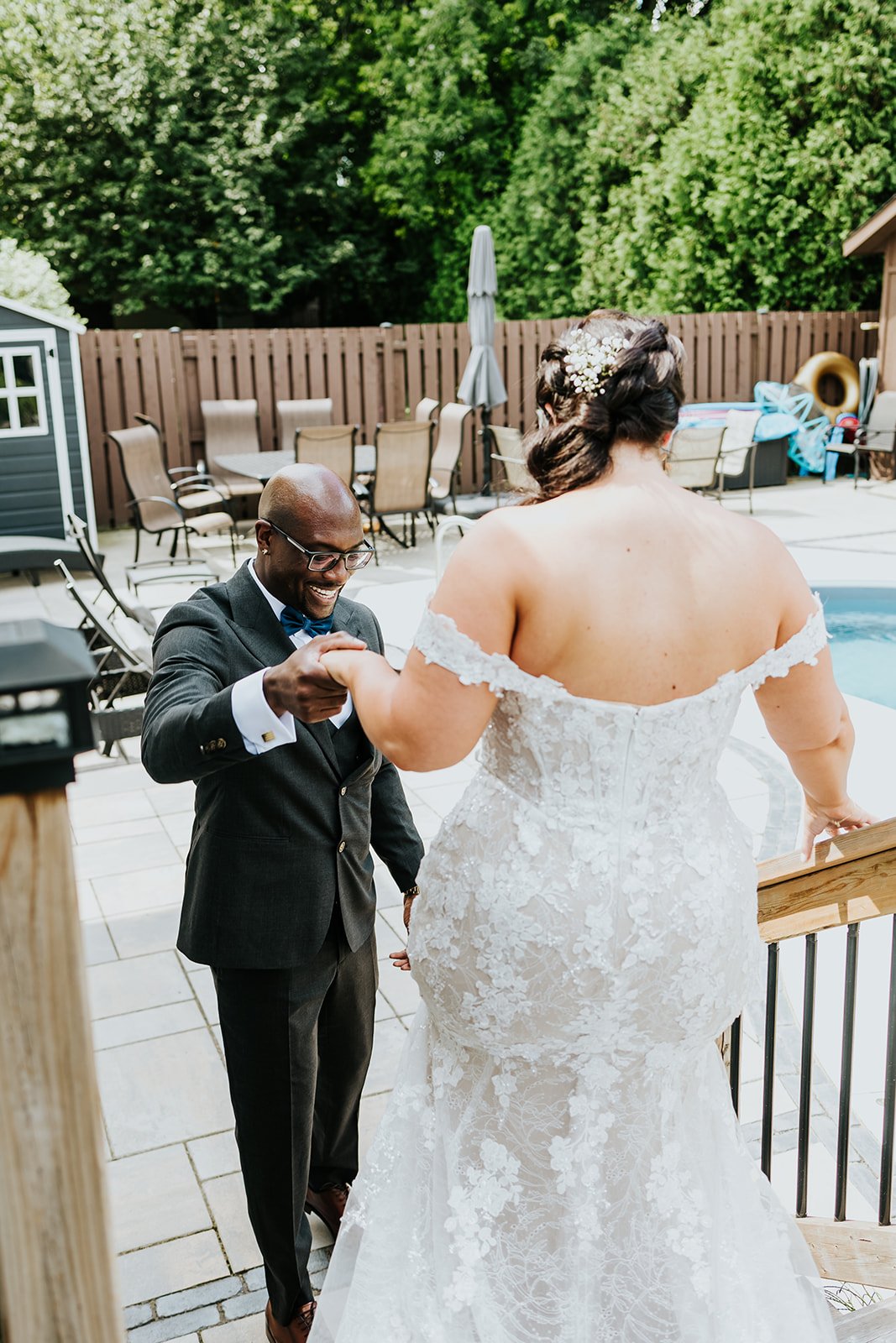 Groom smiles while seeing his bride at first look photo by Fedora Media.jpg