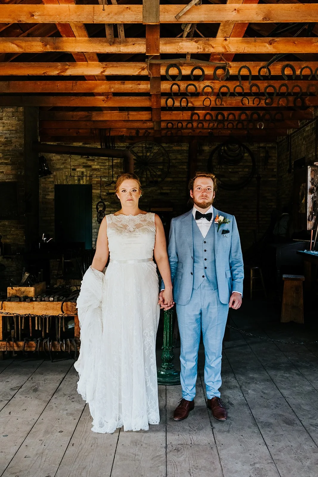 Bride and groom serious photo in pioneer cottage photo by Fedora Media.jpg