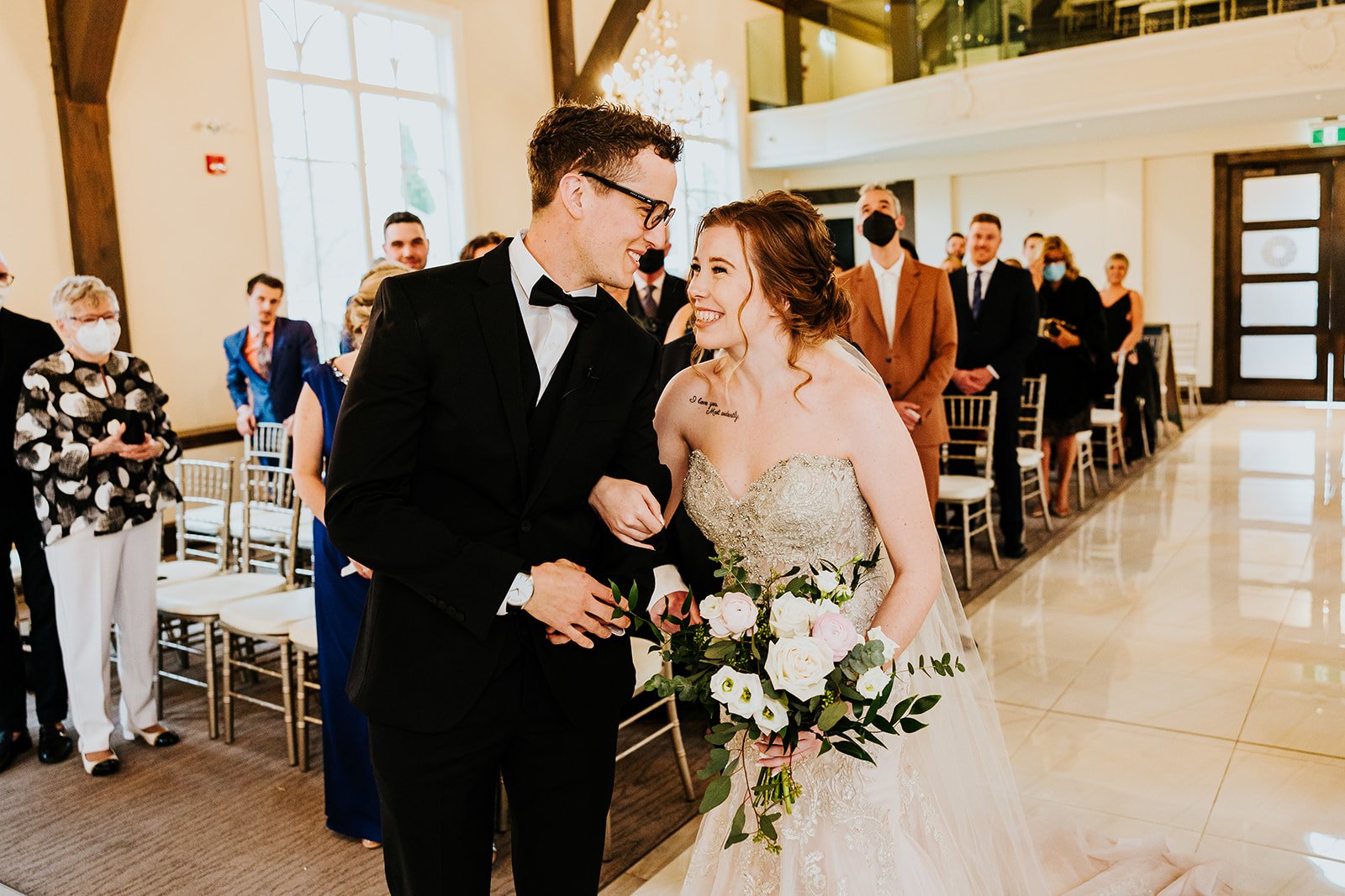 Groom walks the bride down the aisle at the Ancaster Mill photo by Fedora Media.jpg