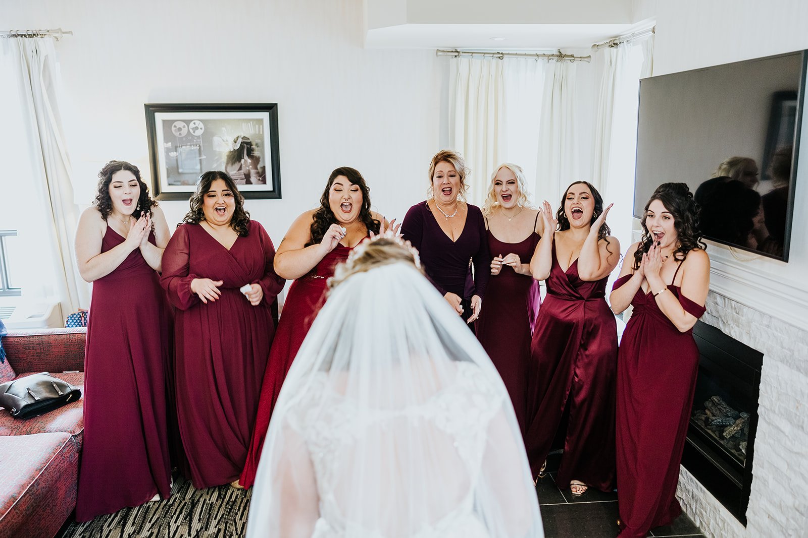 Bridesmaids in red have a first look with the bride photo by Fedora Media.jpg