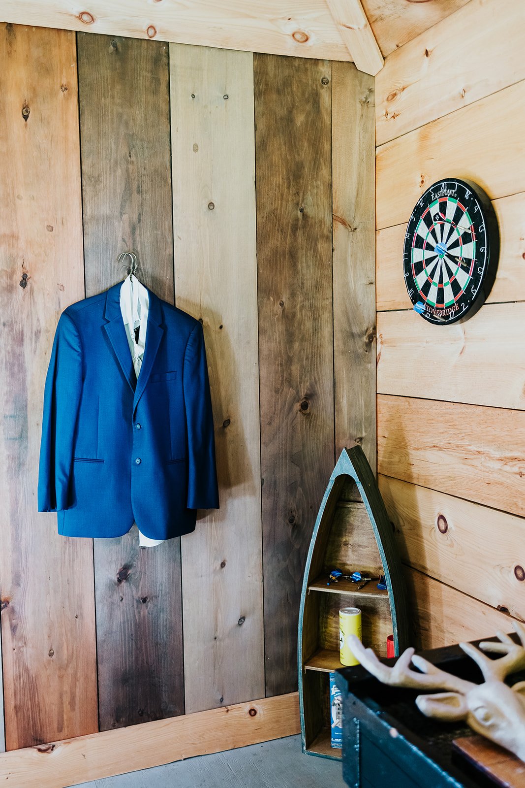 Grooms blue suit hanging in a cabin at CJ Country Events photo by Feodra Media.jpg