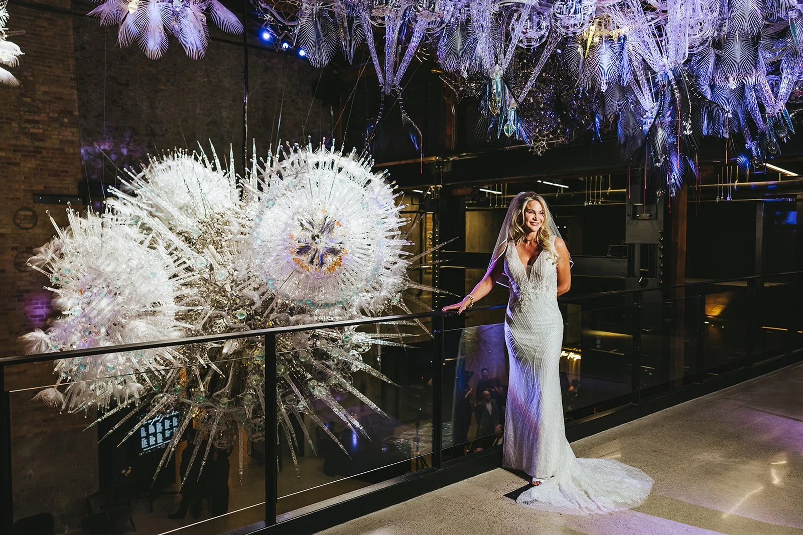 Bride by unique lighting fixture Photo by Fedora Media.jpg