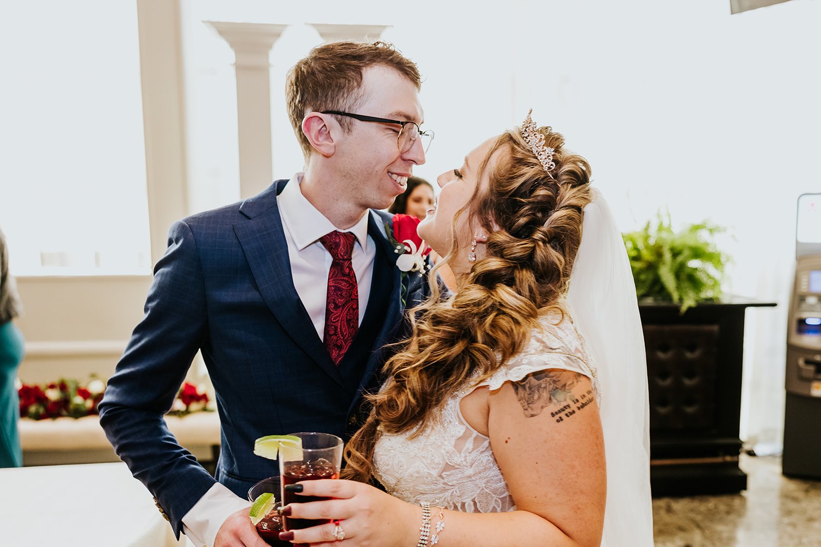 Tattoed bride and groom have a candid moment photo by Fedora Media.jpg