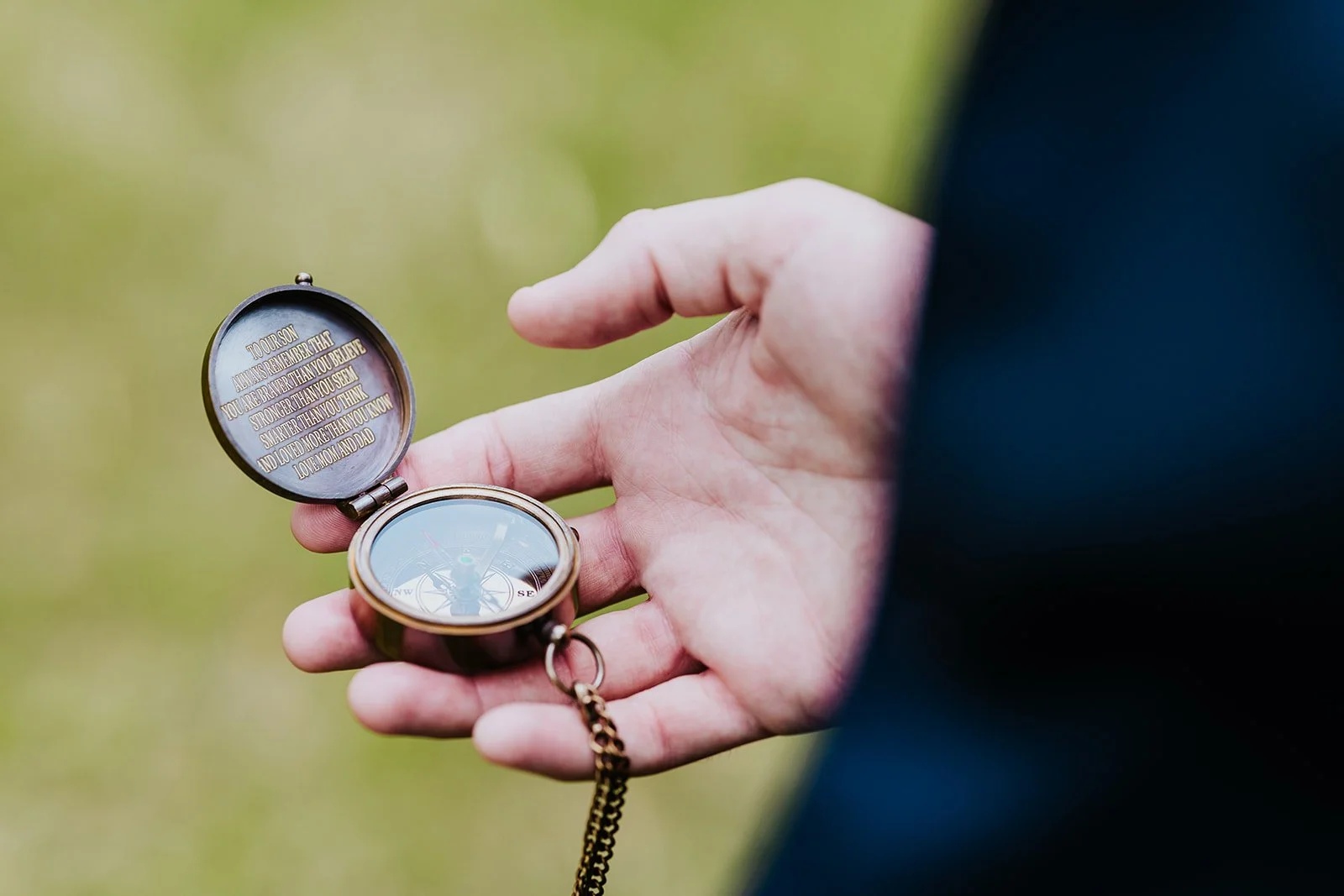 Groom looking at an antique stopwatch Photo by Fedra Media.jpg