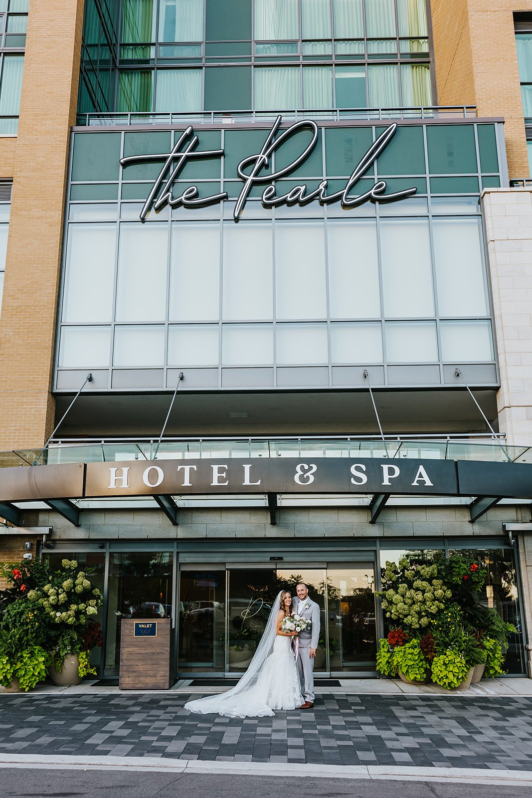 Bride and groom in front of the Pearle Hotel and Spa photo by Fedora Media.jpg