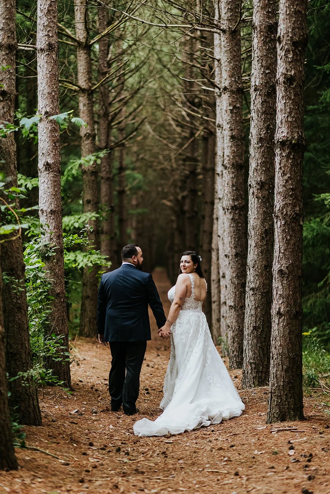 Bride and groom in the endless corridor at Erin Estate photo by Fedora Media.jpg