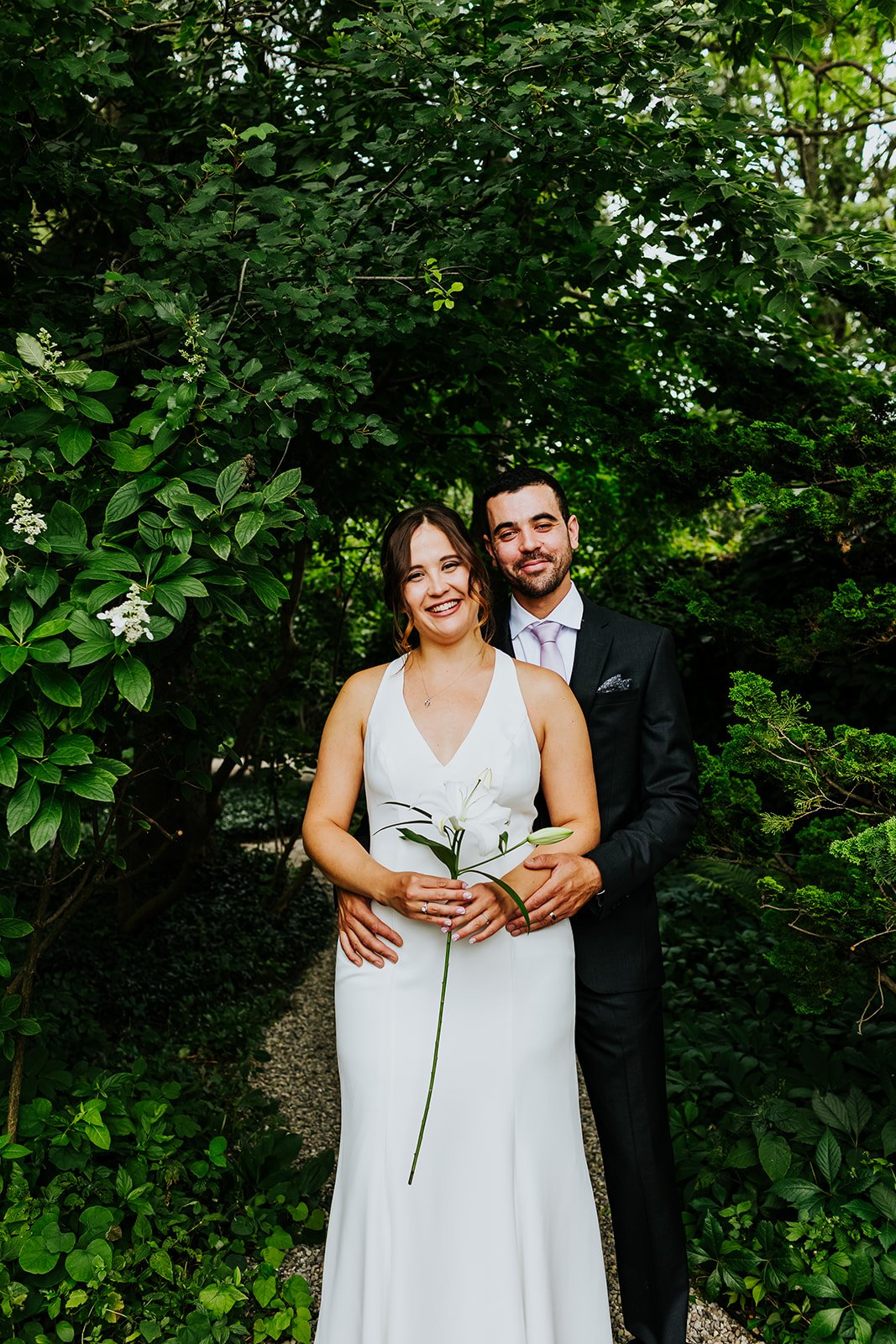 Bride and groom pose in backyard wedding photo by Fedora Media.jpg
