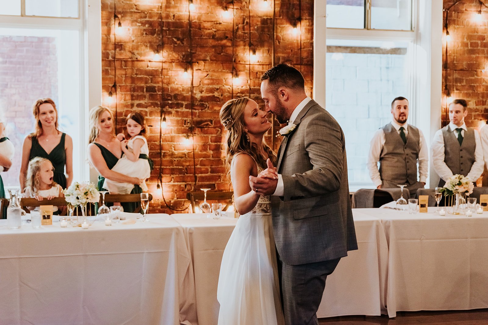 Bride and groom first dance with beautiful lighting photo by Fedora media.jpg