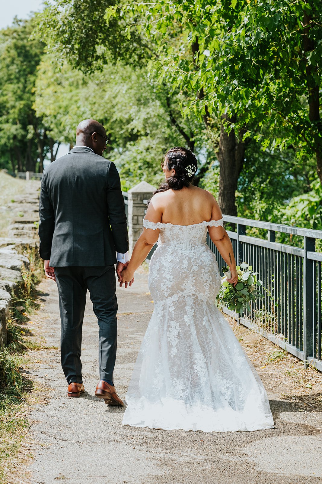 Bride and groom walking away photo by Fedora Media.jpg