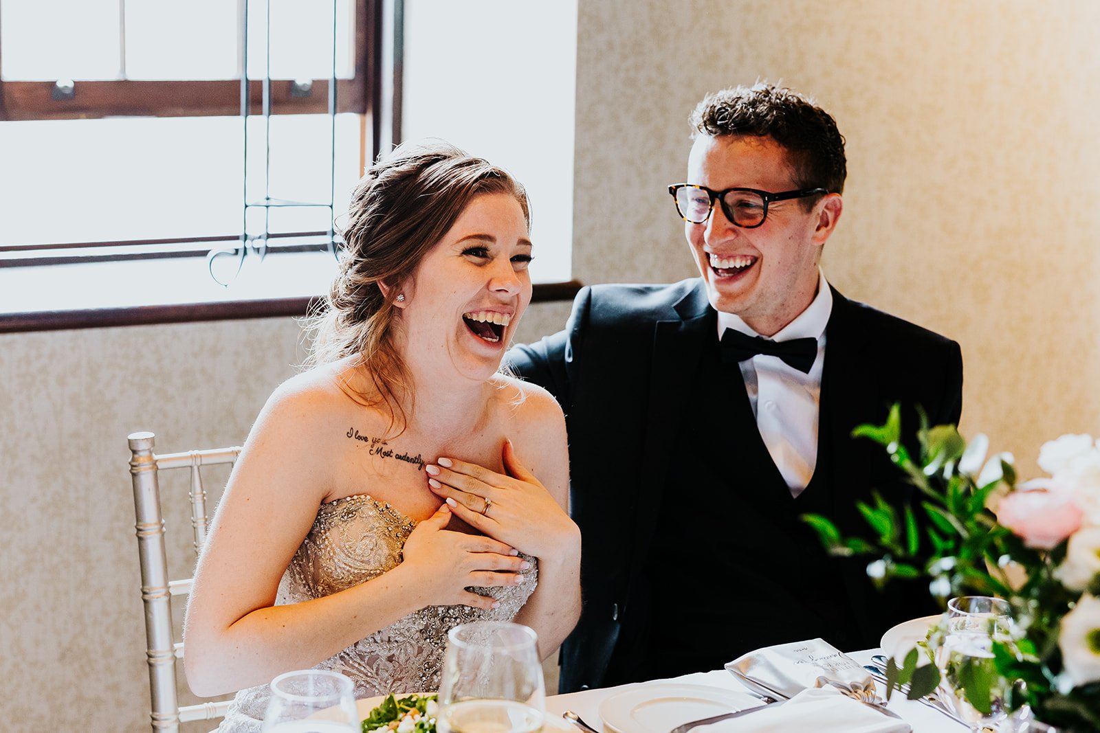 Bride and groom candid moment at their reception at the Ancaster Mill photo by Fedora Media.jpg