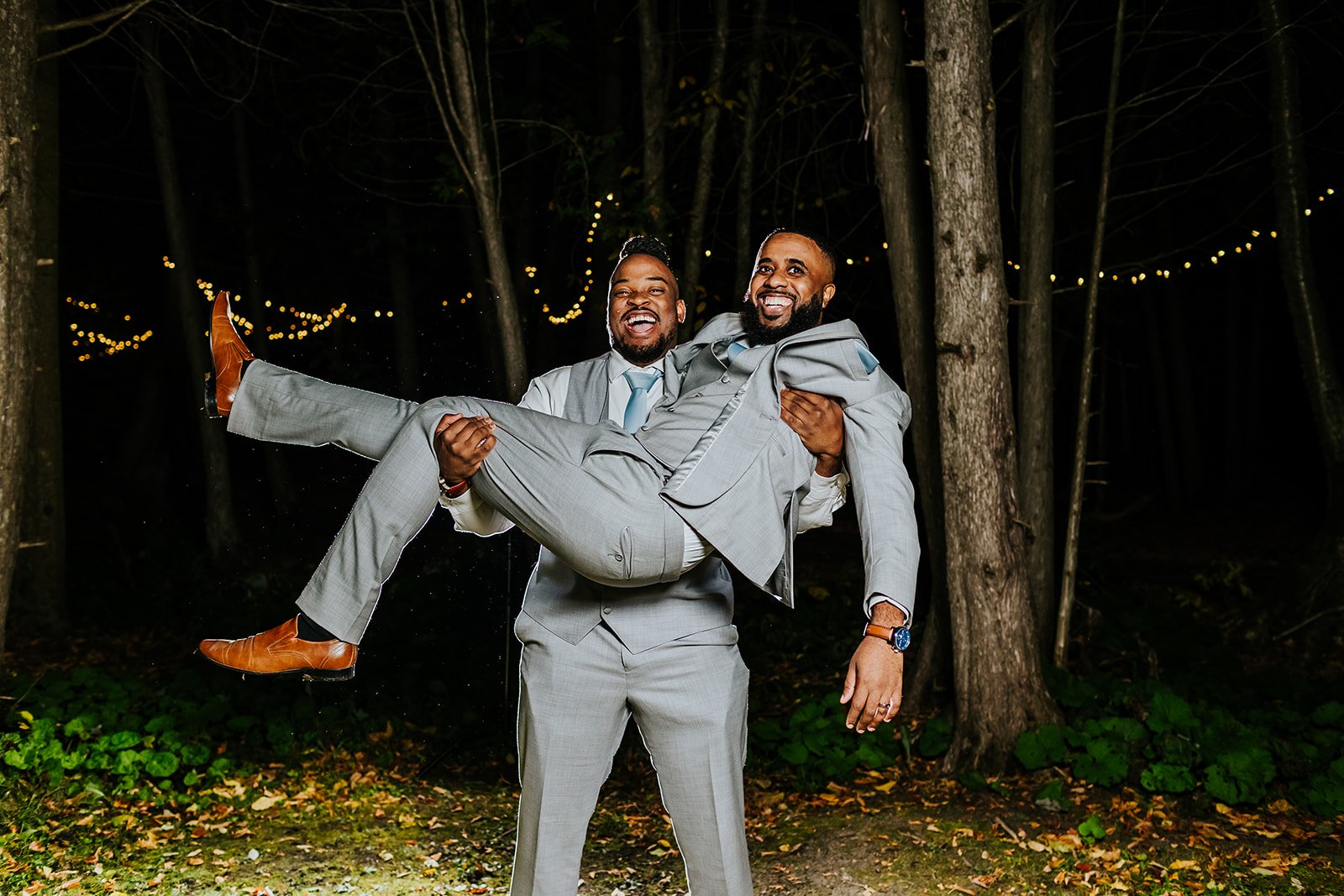 Bestman carries groom photos by fedora media.jpg