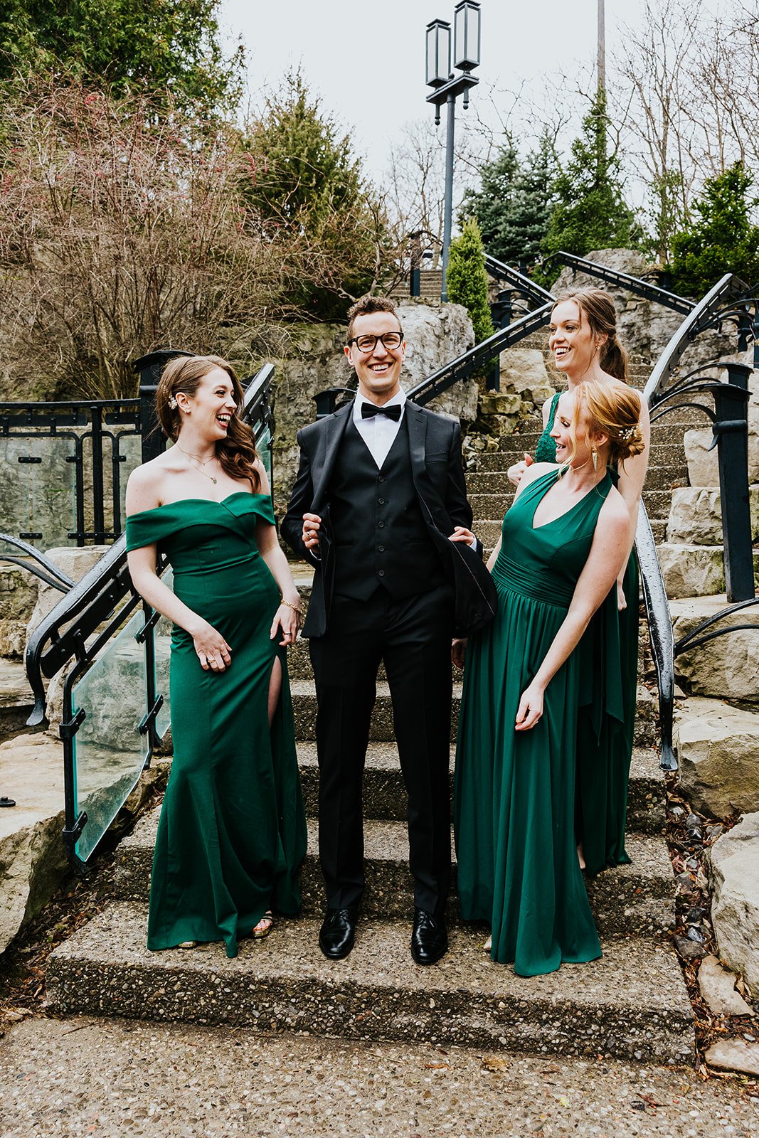 Groom with bridesmaids dressed in green at the Ancaster Mill photo by Fedora Media.jpg