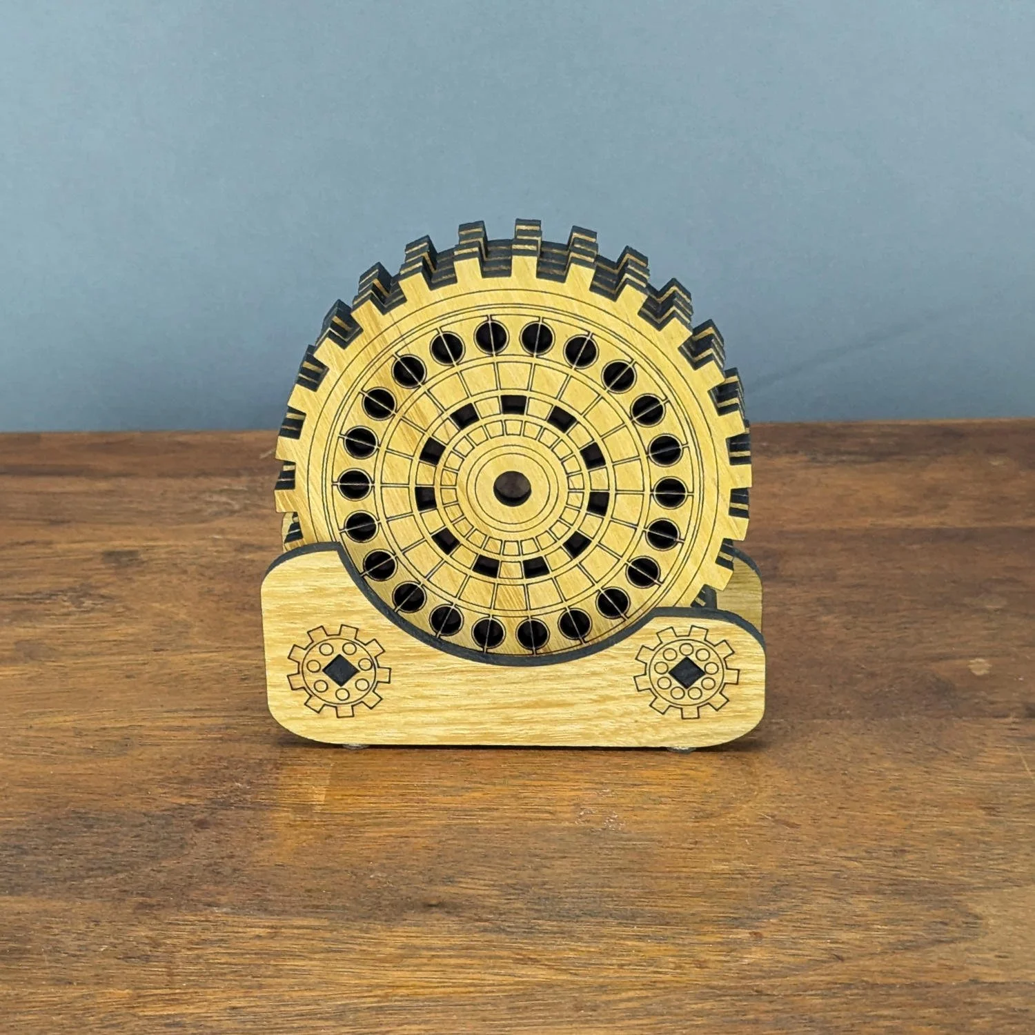 Solid Black Locust coaster stand holding gear-themed coasters