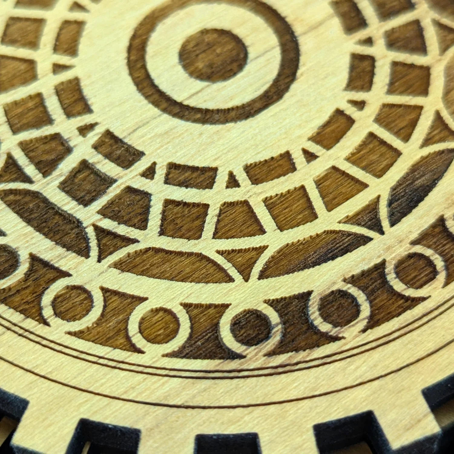 Close-up of deep laser engraving in solid wood