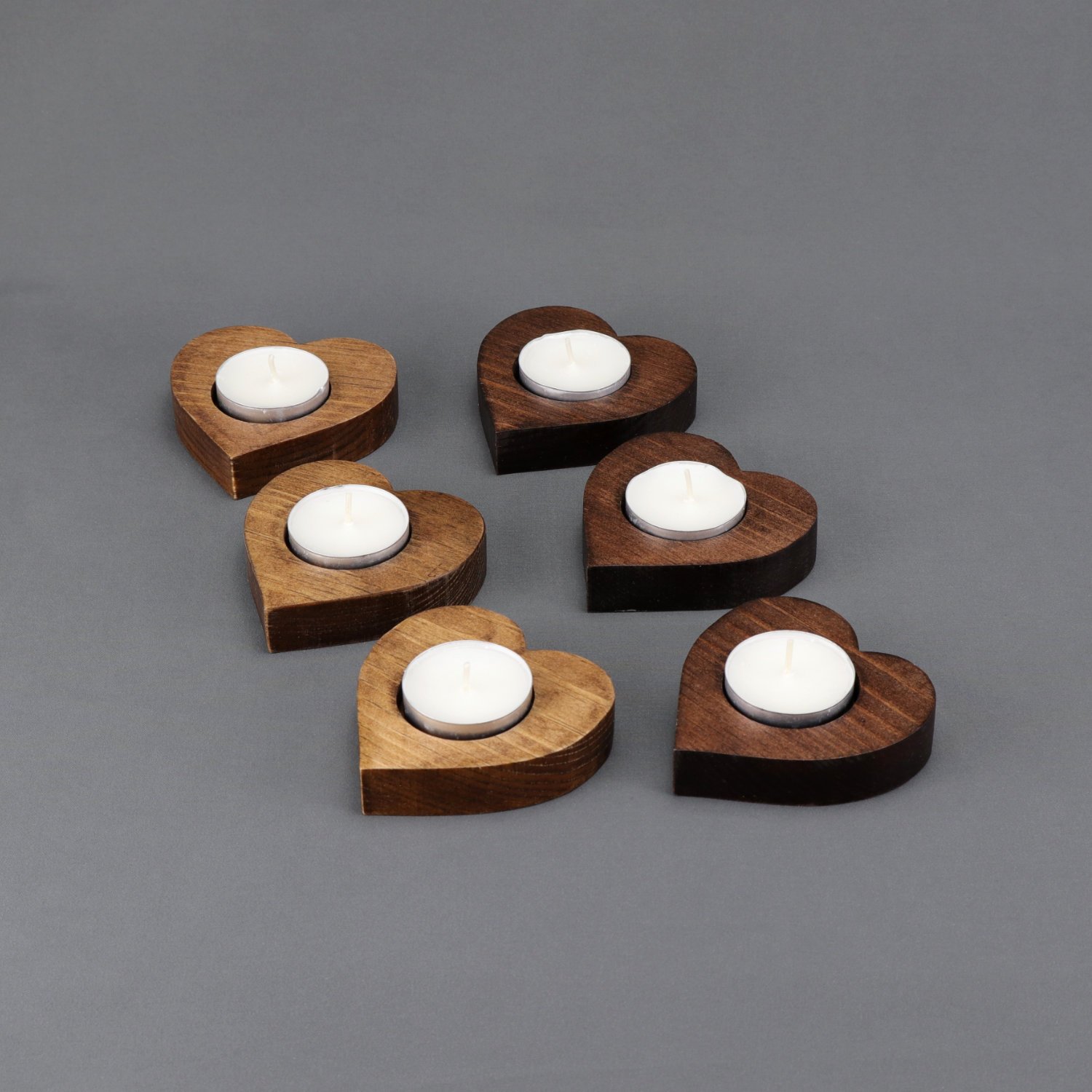 Set of six heart-shaped wooden tealight candle holders in mixed light and dark stain finishes