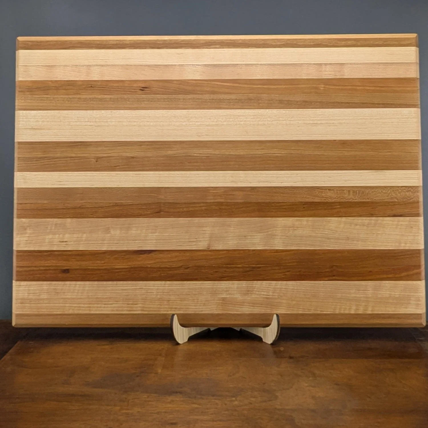 Maple cutting board stand holding a cutting board
