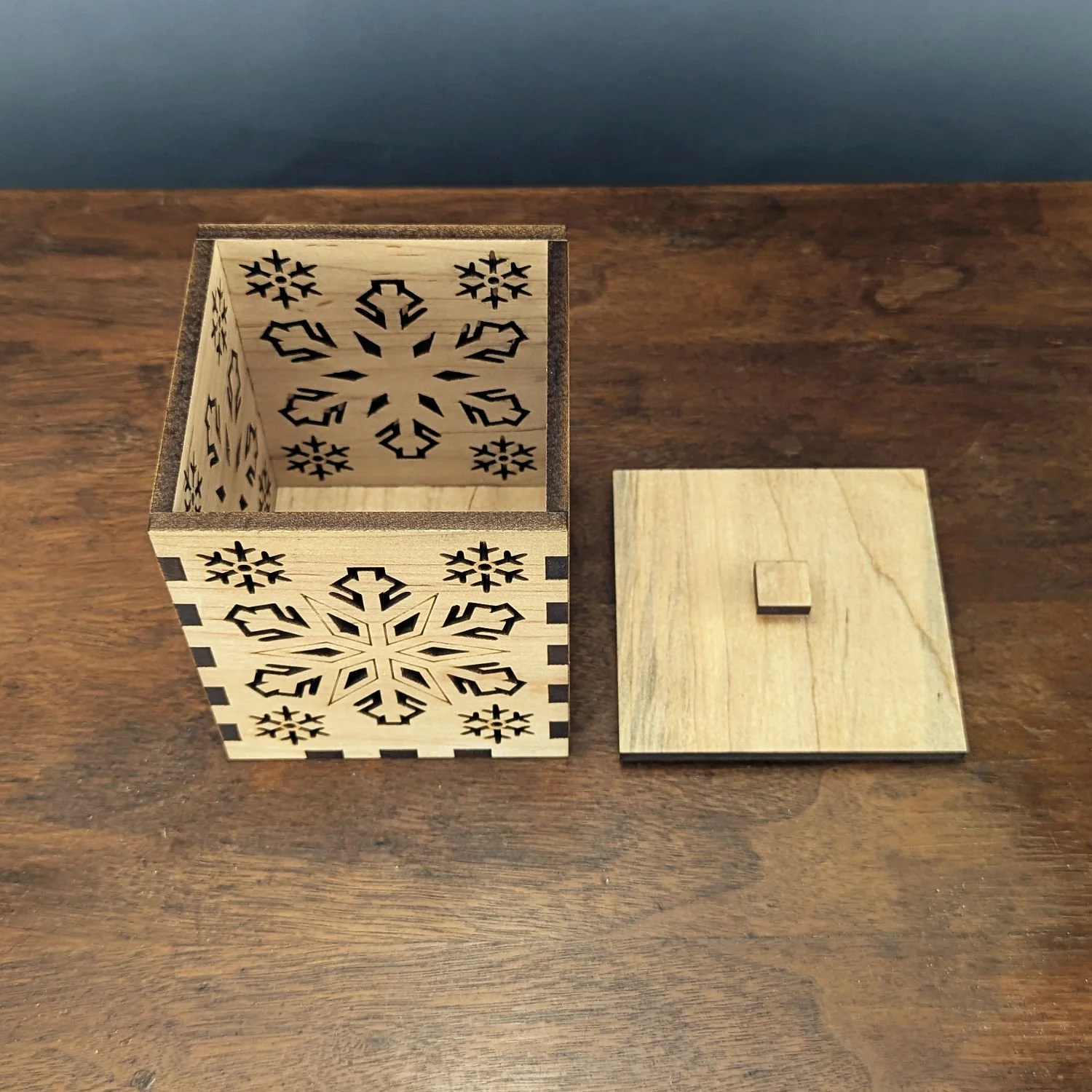 Top-down view of the Maple Snowflake Lantern with lid removed, showing box-joint construction.