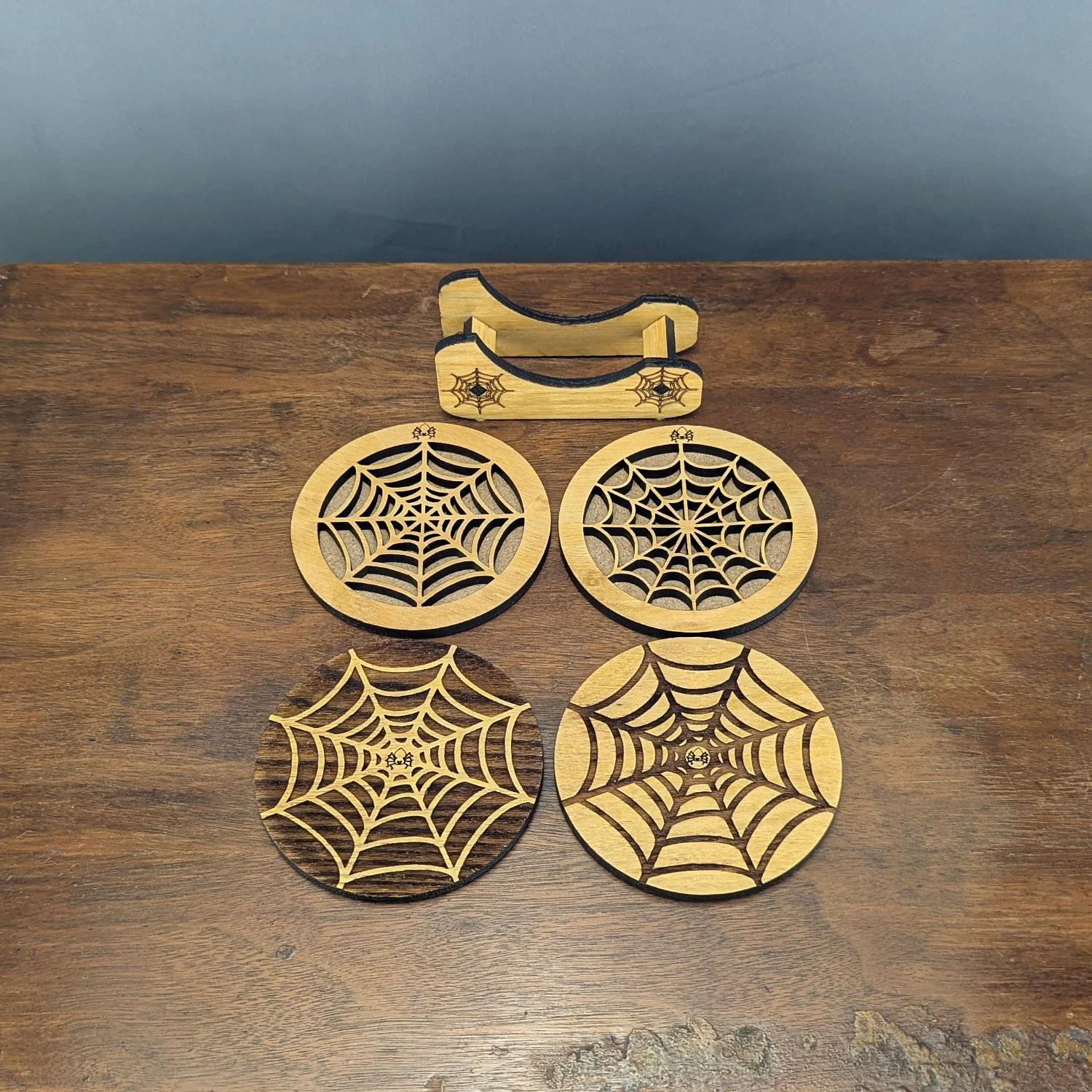 Full Webworks Collection Set Two showing Shadow, Golden, Phantom, and Lace Web coasters with matching holder.